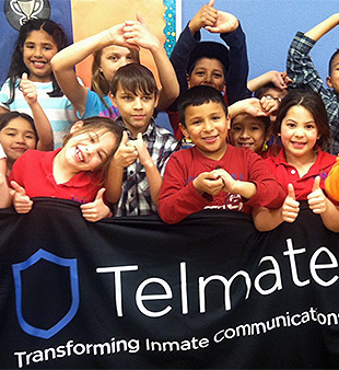 groupshot - kids with Telmate banner