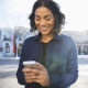 woman smiling at cellphone