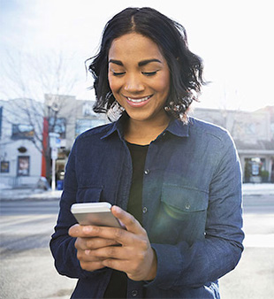 woman smiling at cellphone