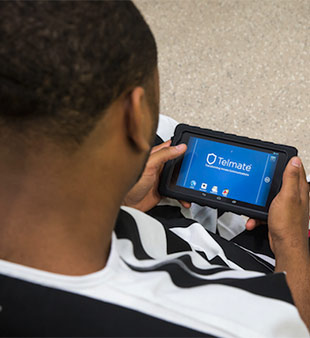 inmate using tablet