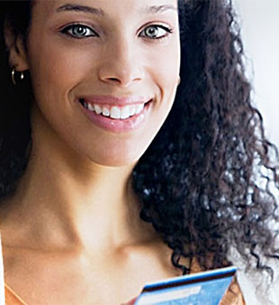 woman smiling with card