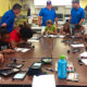 Volunteers Get Kids to Take Apart Tablets