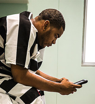 inmate using tablet