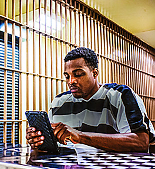 inmate using tablet