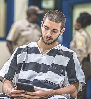 inmate using tablet